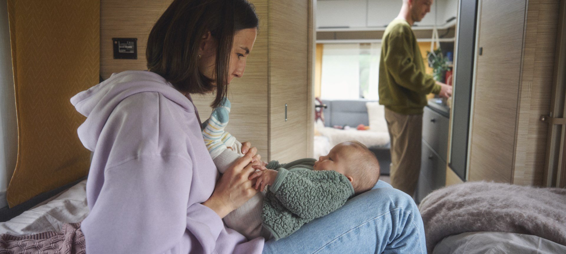 Mom indoors with baby.