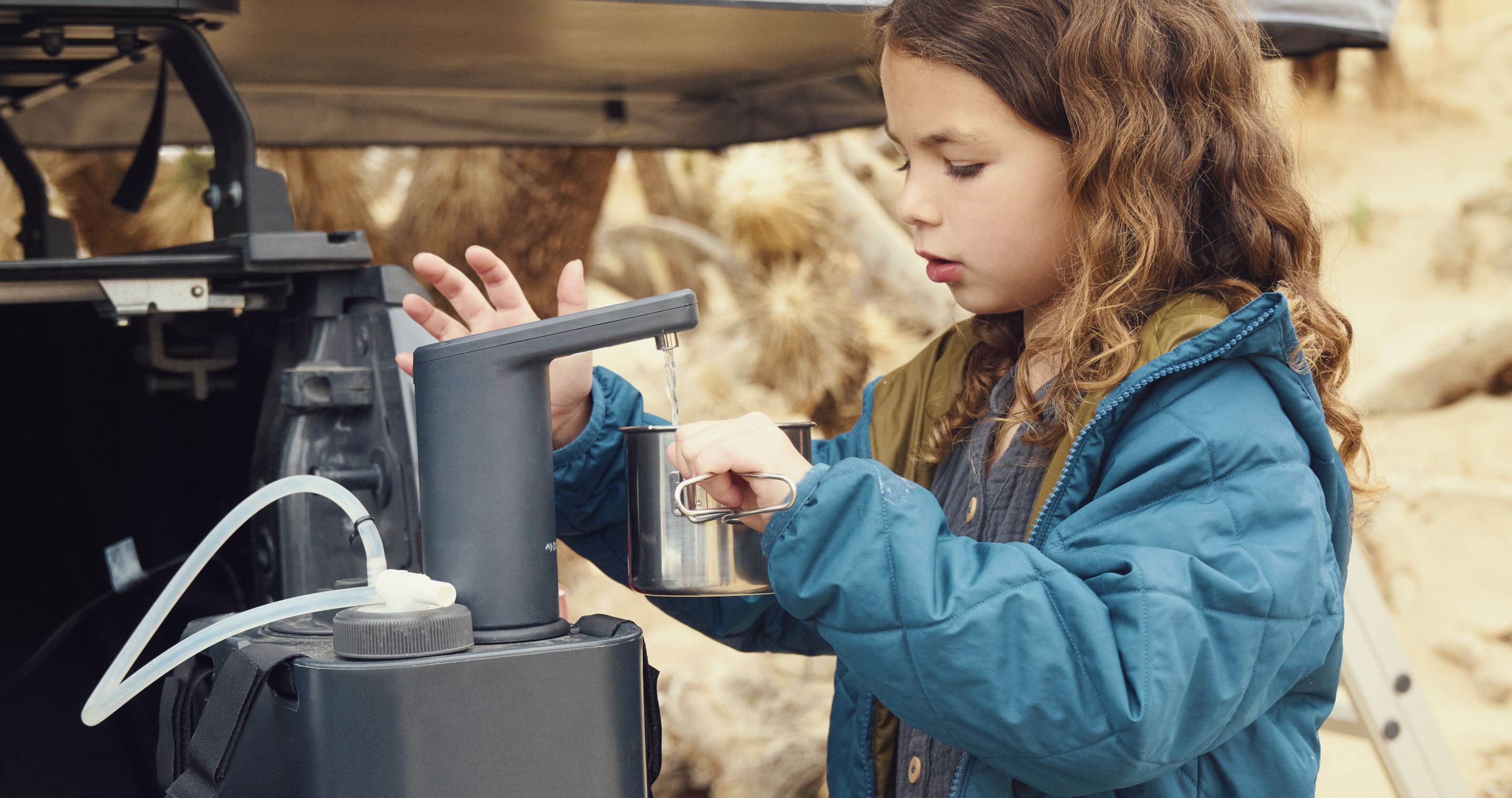 Girl using hyration faucet