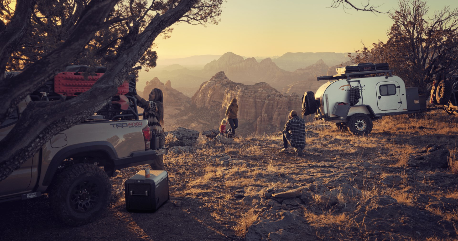 Family with camp set up in the mountains