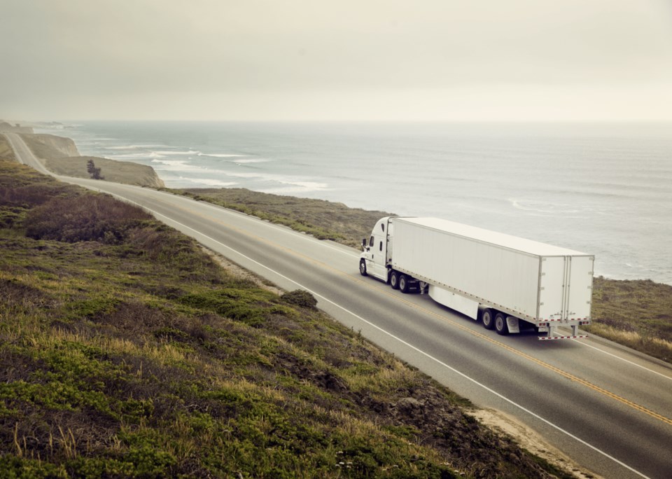 Truck driving along coast