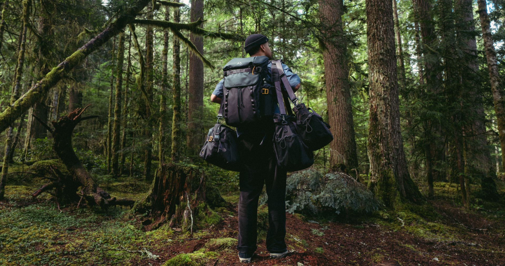 man with carrying bags in outdoors.