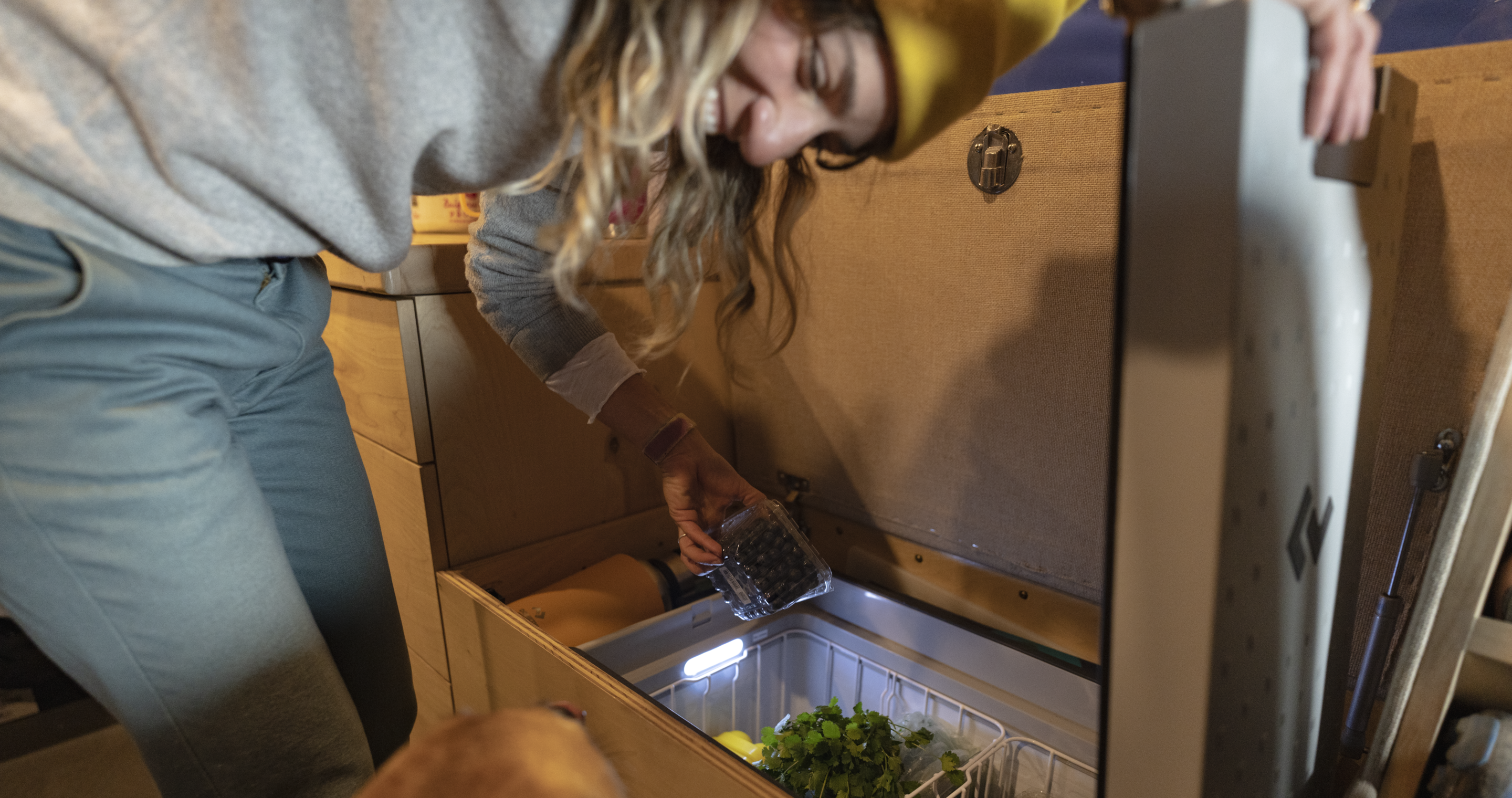 woman in cooler with fresh food